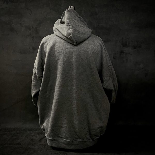 Image of a gray hoodie in front of a black background.