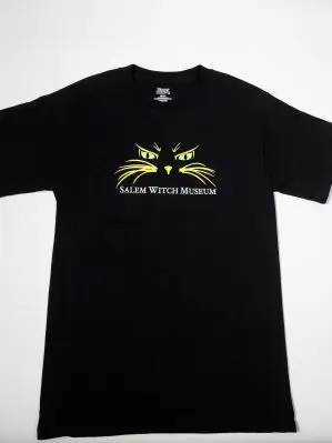 Black t-shirt with cat eyes and whiskers with "Salem Witch Museum" text