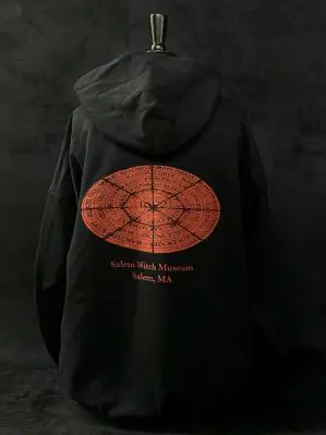 Back side of red circle hoodie which features the red circle with the 1692 victims names along with 'Salam Witch Museum' written beneath it.