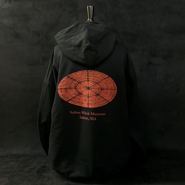 Back side of red circle hoodie which features the red circle with the 1692 victims names along with 'Salam Witch Museum' written beneath it.