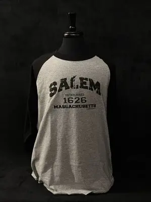 Image of gray and black baseball style longsleeve t-shirt. Front side reads 'Salem Est 1626' in black lettering.