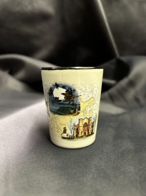 Salem montage shot glass. Features iconic locations from Salem overlaid with a vintage map of the area. Also features text reading "Salem Massachusetts".