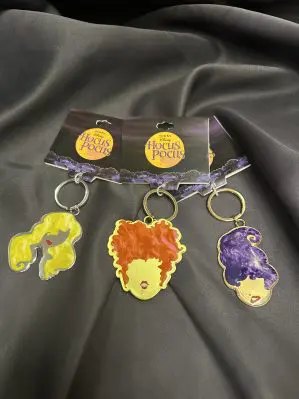 Hocus Pocus Keychains. A minimalist drawing of each of the Sanderson sisters' faces and Thackery Binx.