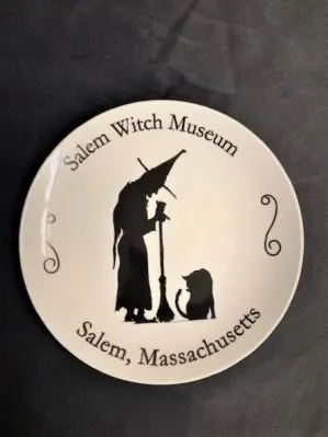 Vintage throwback plate with our logo and the words "Salem Witch Museum" and "Salem, Massachusetts".